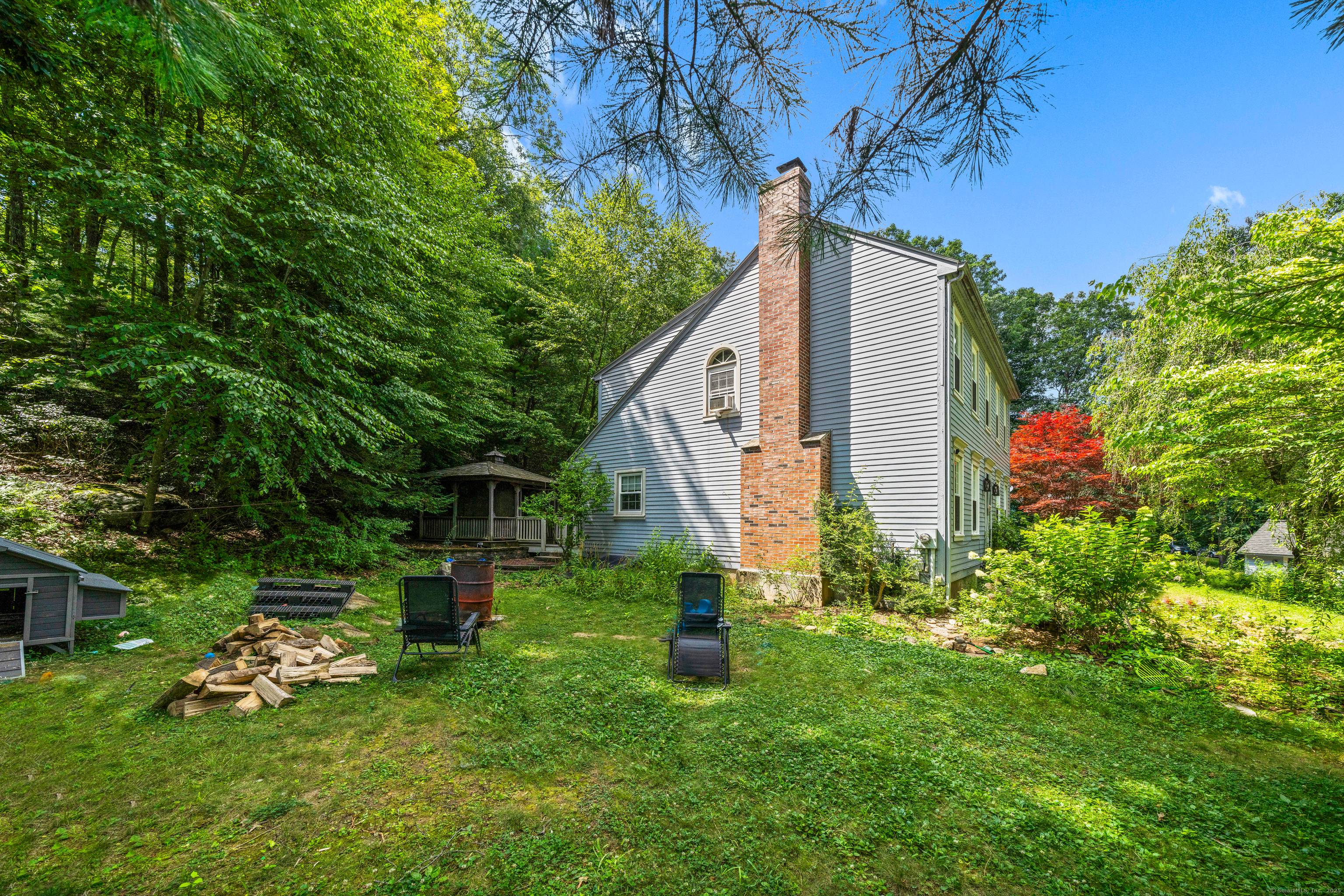 Tucked away on nearly 2 private acres, this beautifully maintained 3 bedroom, 2.