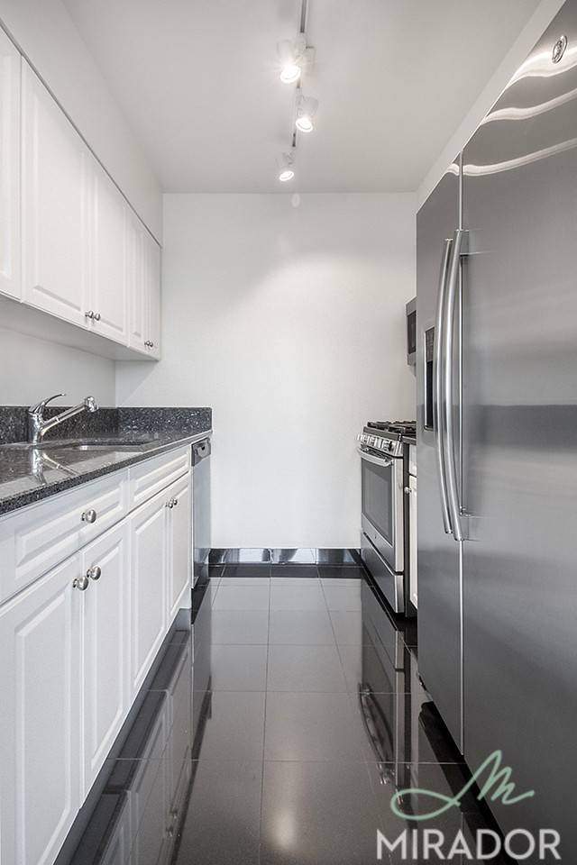 Bright and sunny, this south facing two bedroom apartment features new strip hardwood floors, solar shades, a large open living space with dining area, abundant closets, oversized windows, two full ...