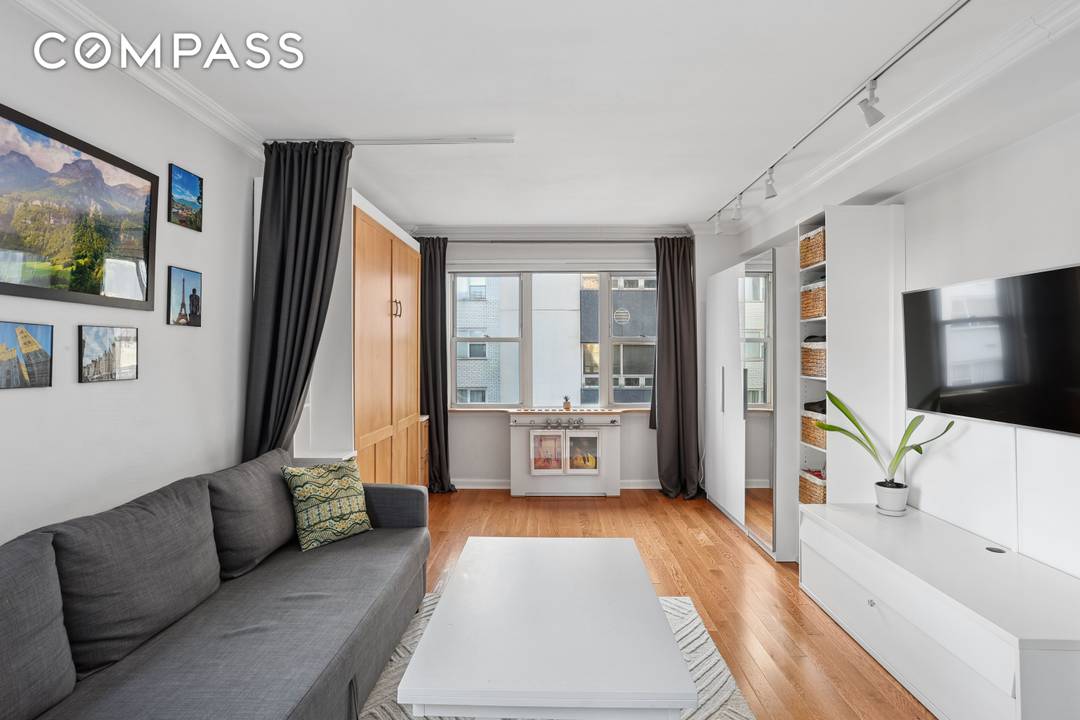 This impeccably renovated corner studio delivers light, design, and turnkey perfection in a full service doorman co op the kind of home that simply shows differently the moment you walk ...