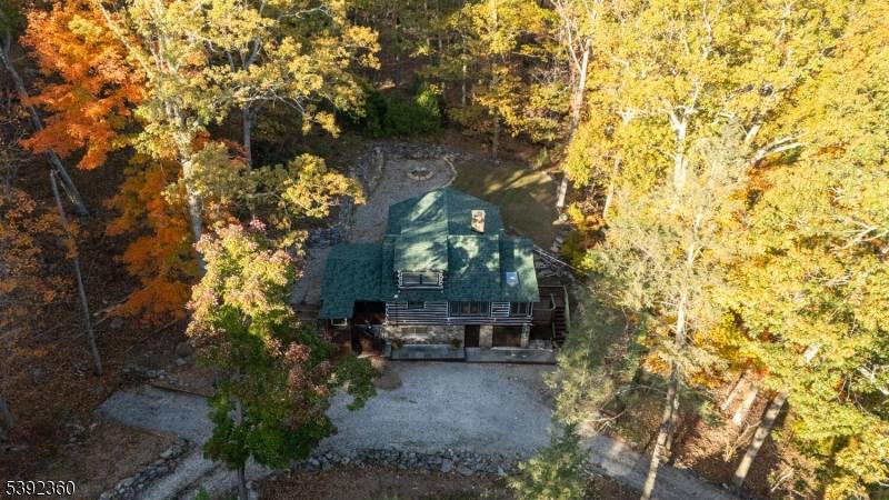 Enchanting chestnut log cabin home, tucked away at the end of a quiet road, is backed by the Abraham Hewitt State Forest hiking trails.
