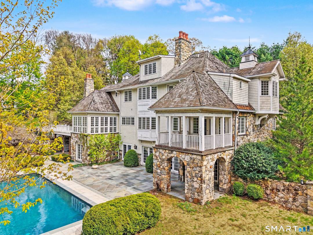 Set at the end of a private cul de sac in Westport's coveted Coleytown neighborhood, 5 Michele Lane is a statement of craftsmanship, scale, and resort style living.