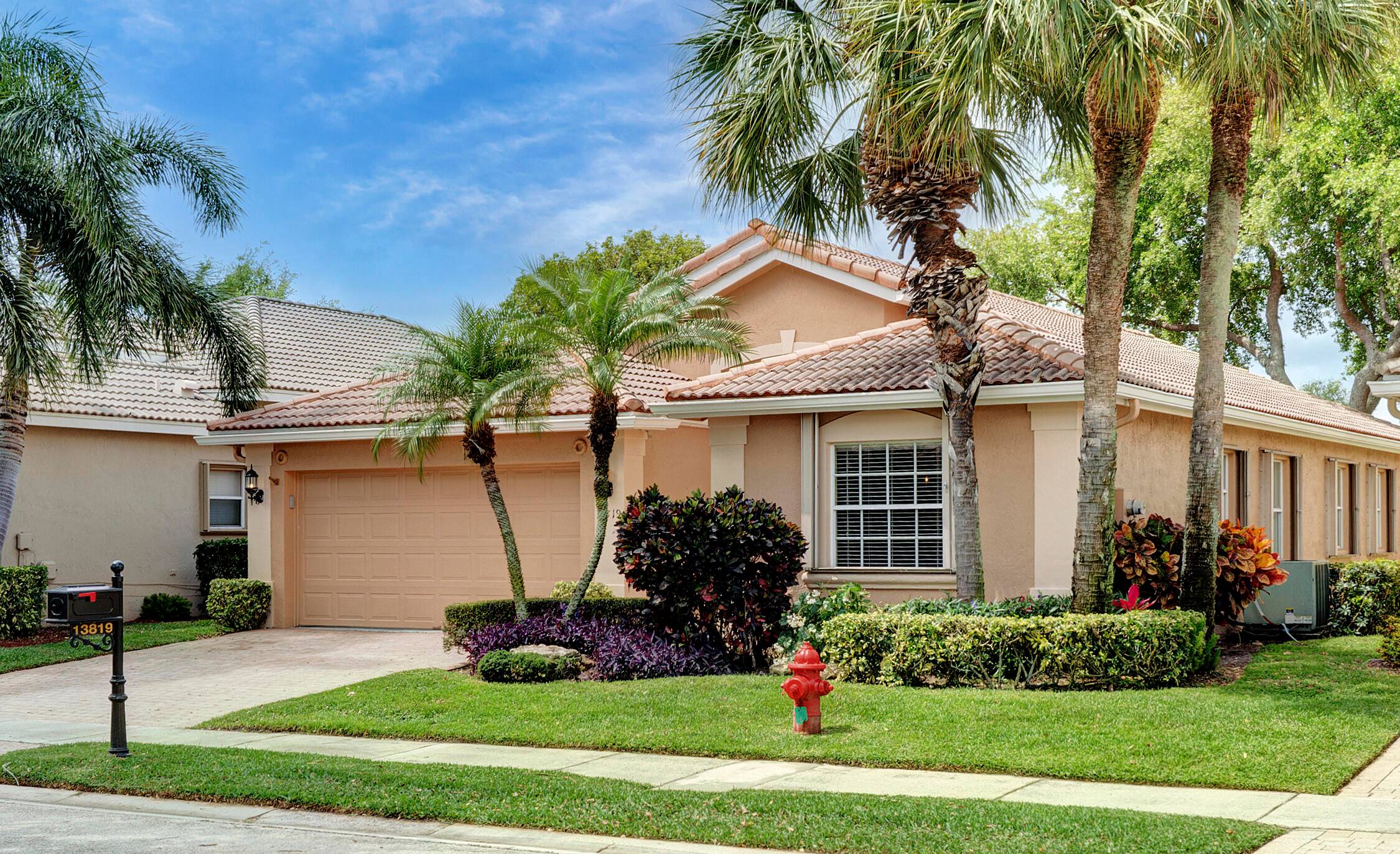 Your Lake View home awaits in this three bedroom, two bath CBS home located in the sought after gated community, Villa Borghese.