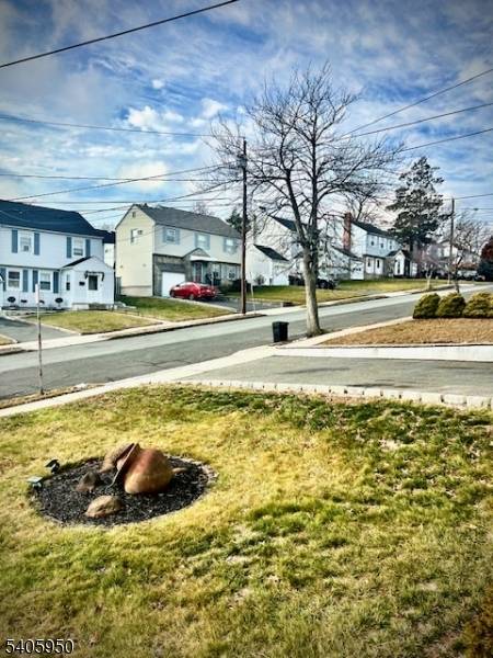 This beautiful single residence boasts a charming interior, with a cozy living room, formal dining room, and kitchen situated on the first floor.