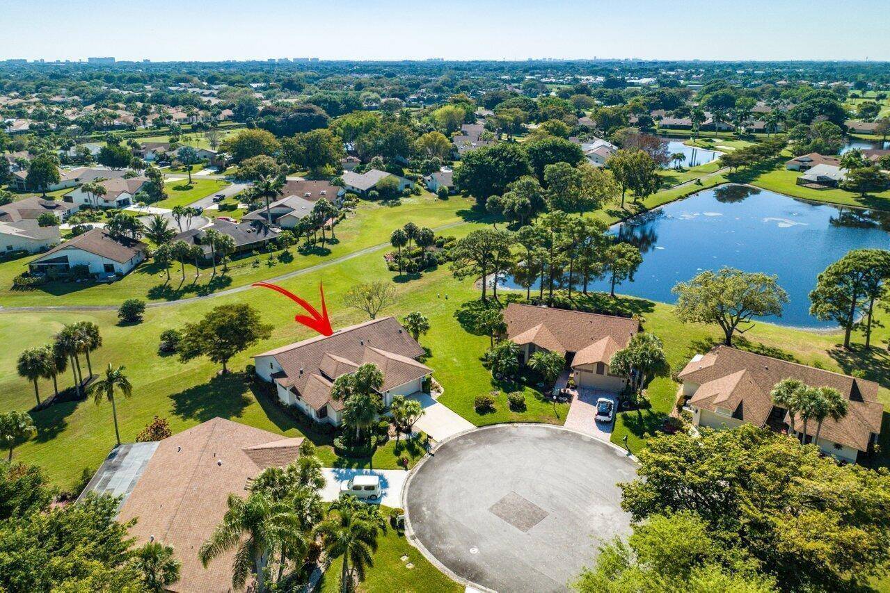 Spacious country club home with a picturesque back yard.