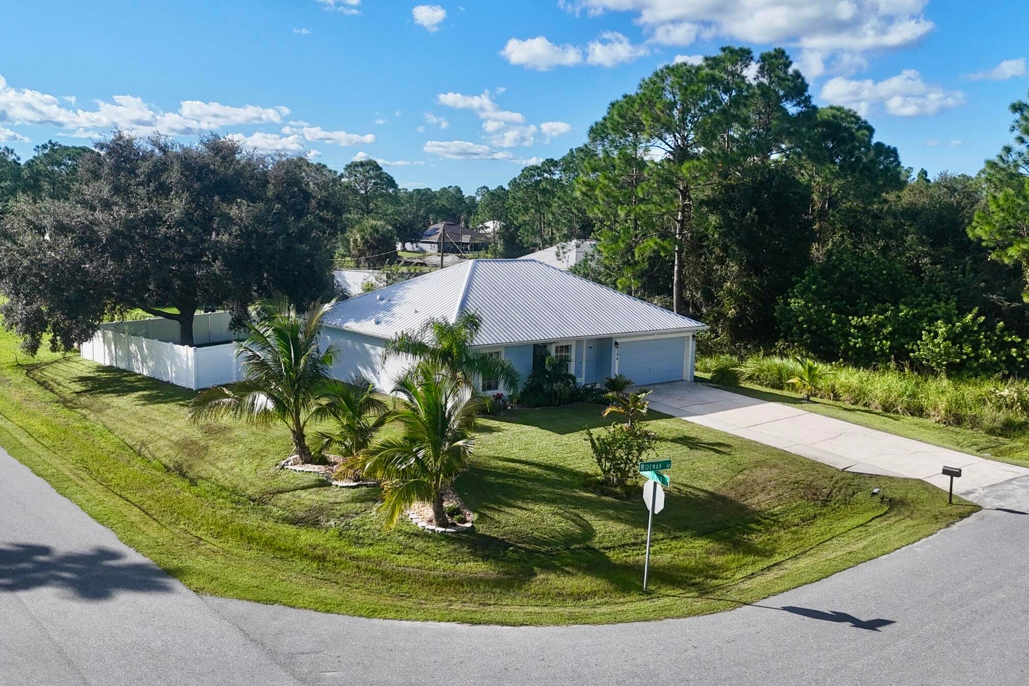 Welcome to this well maintained 3 bed, 2 bath home with a 2 car garage, perfectly situated on a desirable corner lot in Palm Bay.