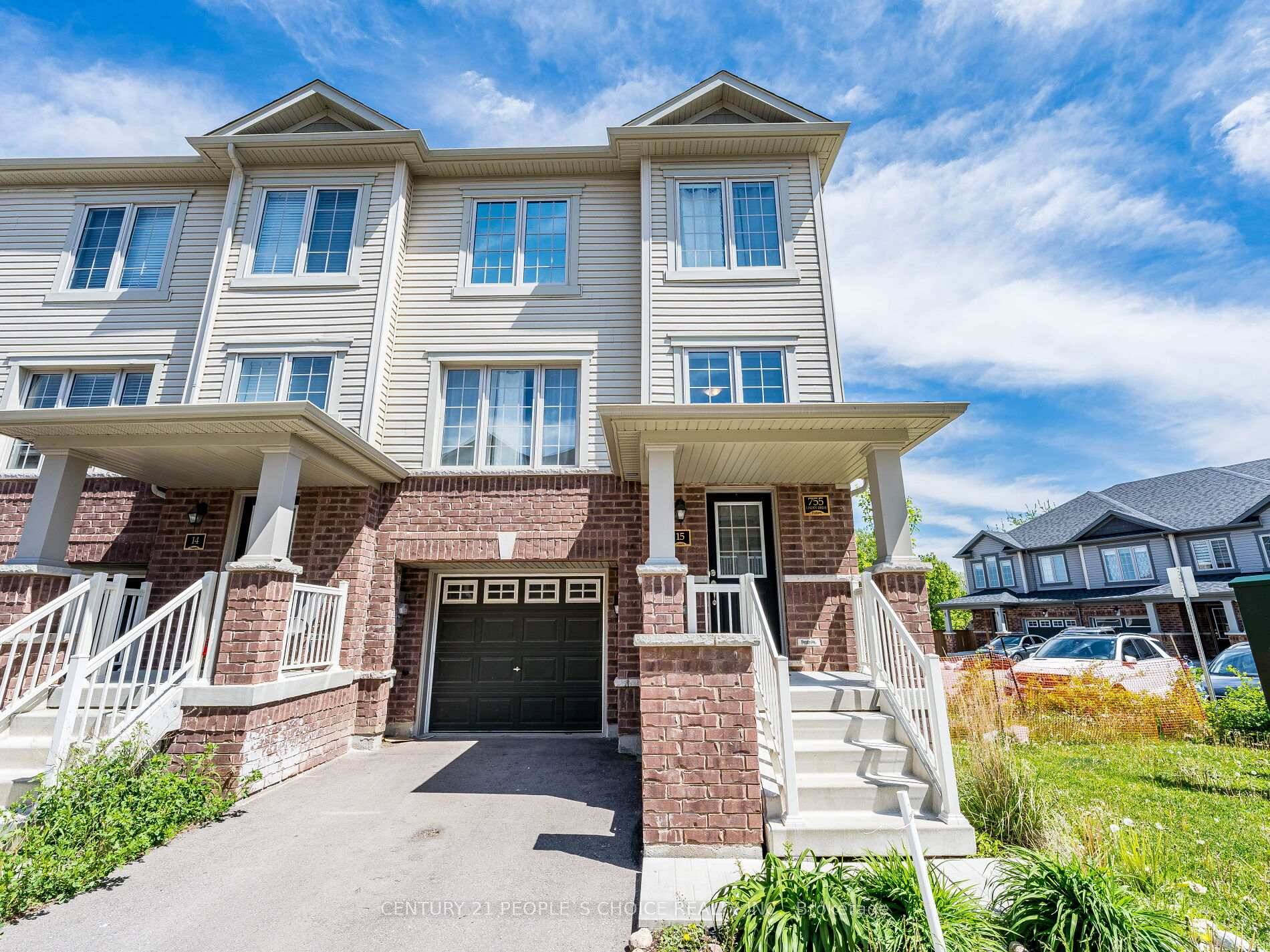 Beautiful End Unit Townhouse Looks like Semi with Private Parking and a Fenced Yard !