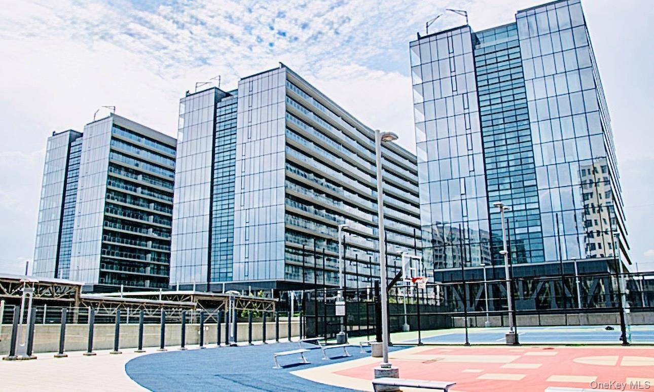 Welcome to one of the largest one bedroom residences in the Grand One Tower at Sky View Parc featuring a bonus room perfect as a home office or guest space.