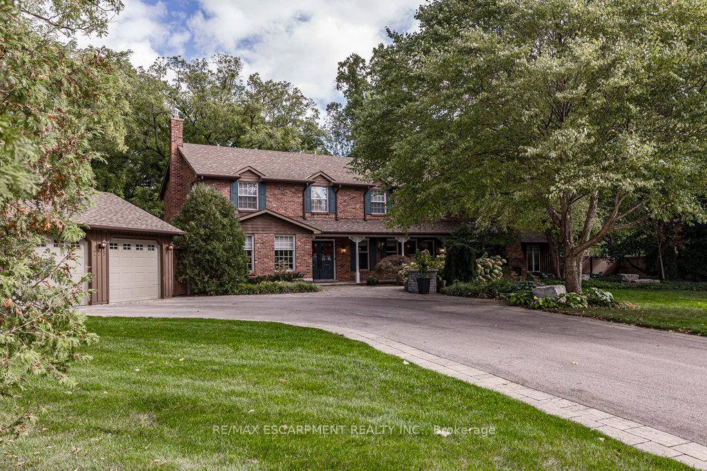 Sprawling 3, 873 sq. ft. family home on a 150' x 200' estate lot on one of Burlington's most sought after streets !