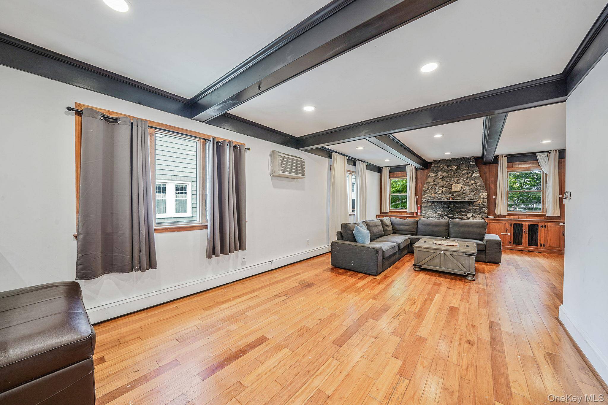 Step into this inviting, light filled home that seamlessly blends warmth and modern comfort.