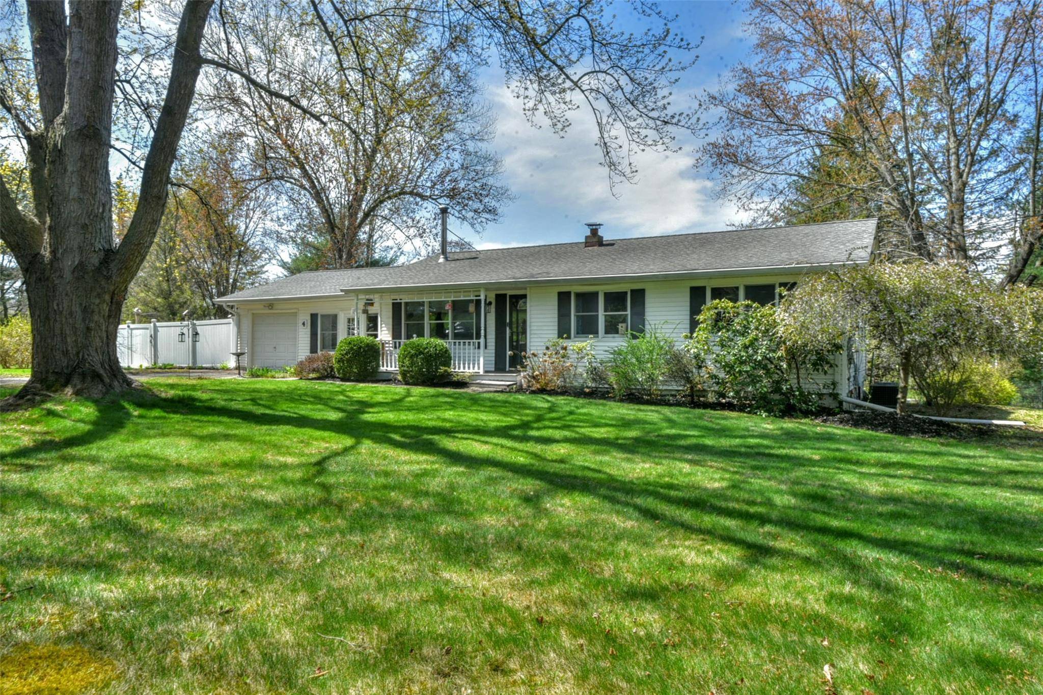 Enjoy the ease of one level living in this beautifully maintained 2 bedroom, 2 bath ranch set on a private, peaceful corner, level lot offering over an acre of land ...