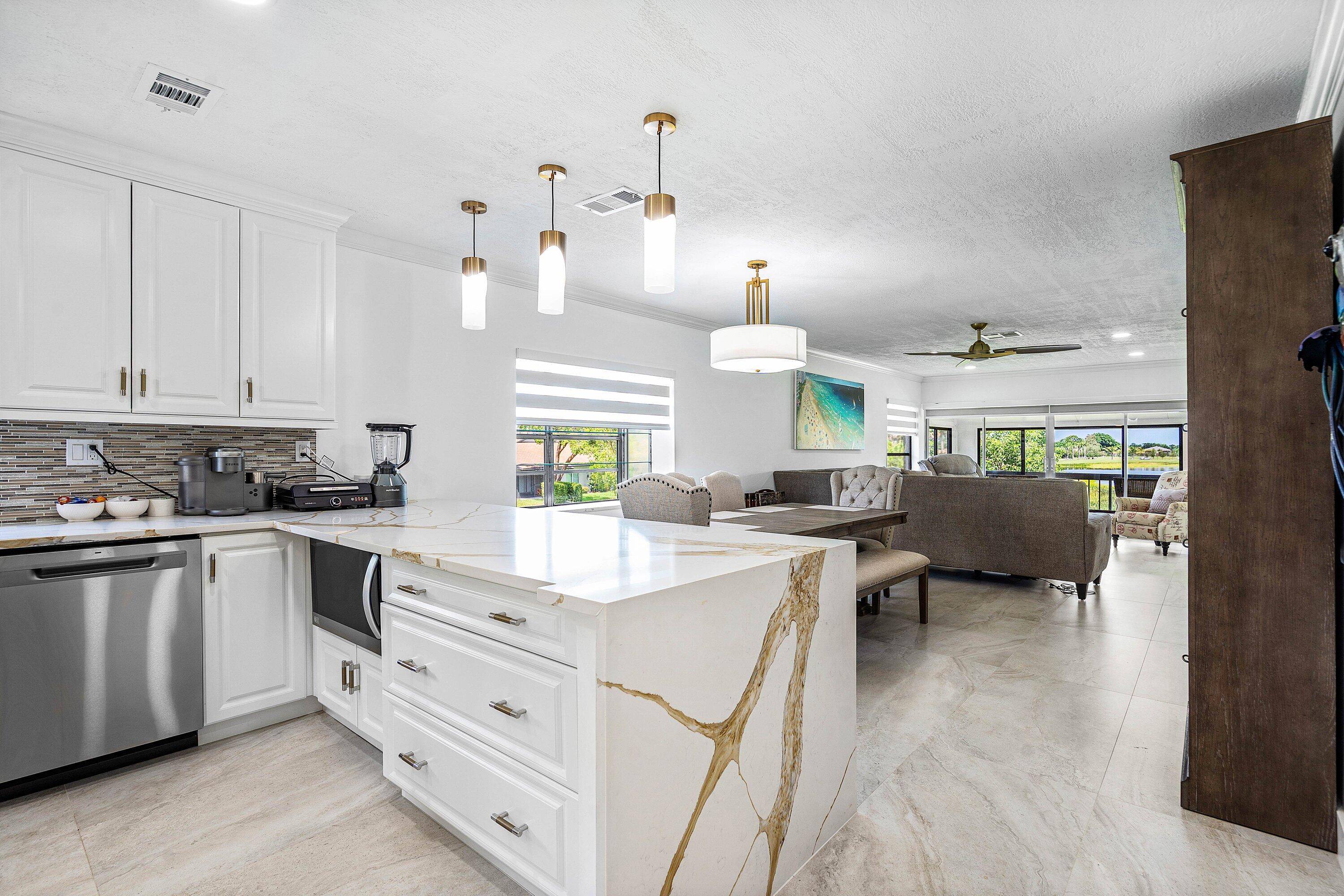 Fully furnished and turnkey, this beautifully remodeled 2BD 2BA condo in Palm Greens of Delray Beach is a true showpiece.
