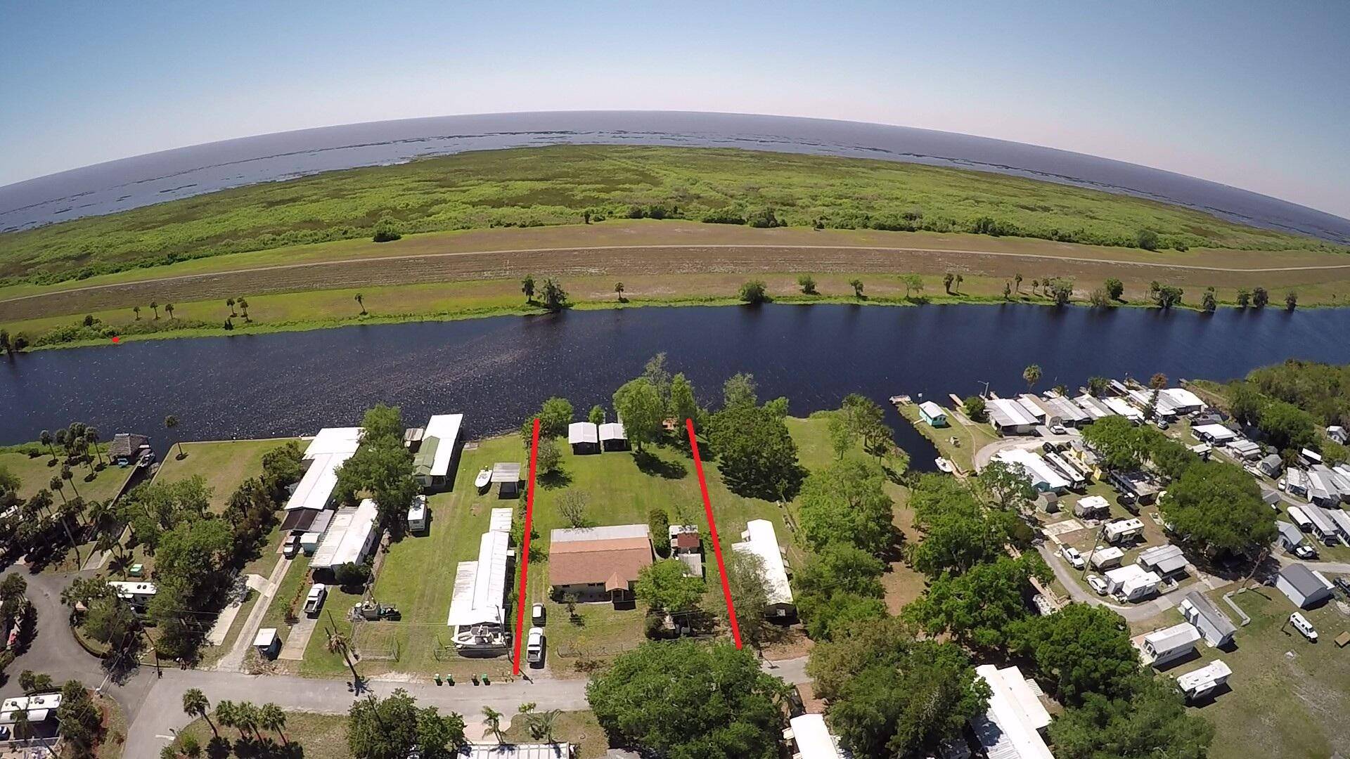 Lake Okeechobee access 1996 Concrete block, single family home.