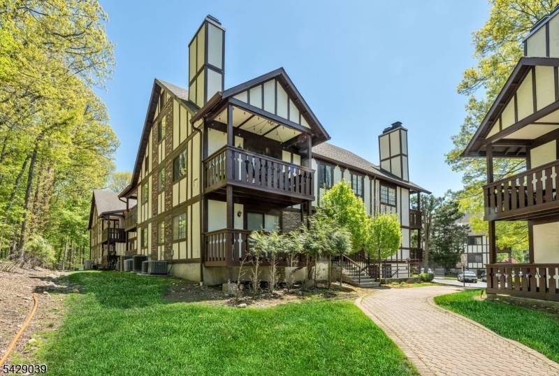 Welcome to this move in ready two bedroom, two bathroom end unit at Ridge Gardens, where an open floor plan and soaring cathedral ceilings create a bright and airy atmosphere.
