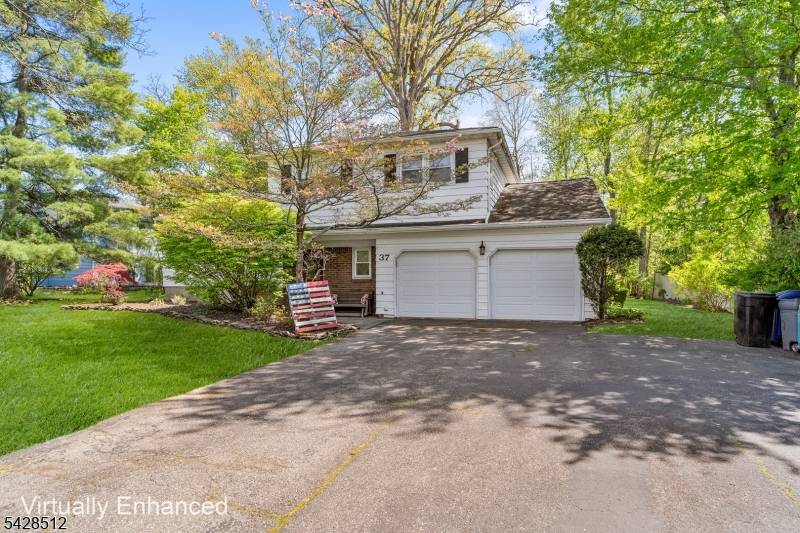 Welcome to this inviting Split Level home nestled in the desirable Pine Brook section of the Manchester at Montville development.