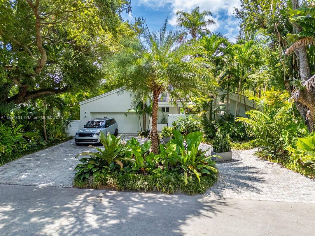 Set amid a lush canopy tree hammock, this Miami Shores gem offers 3, 378 sq.