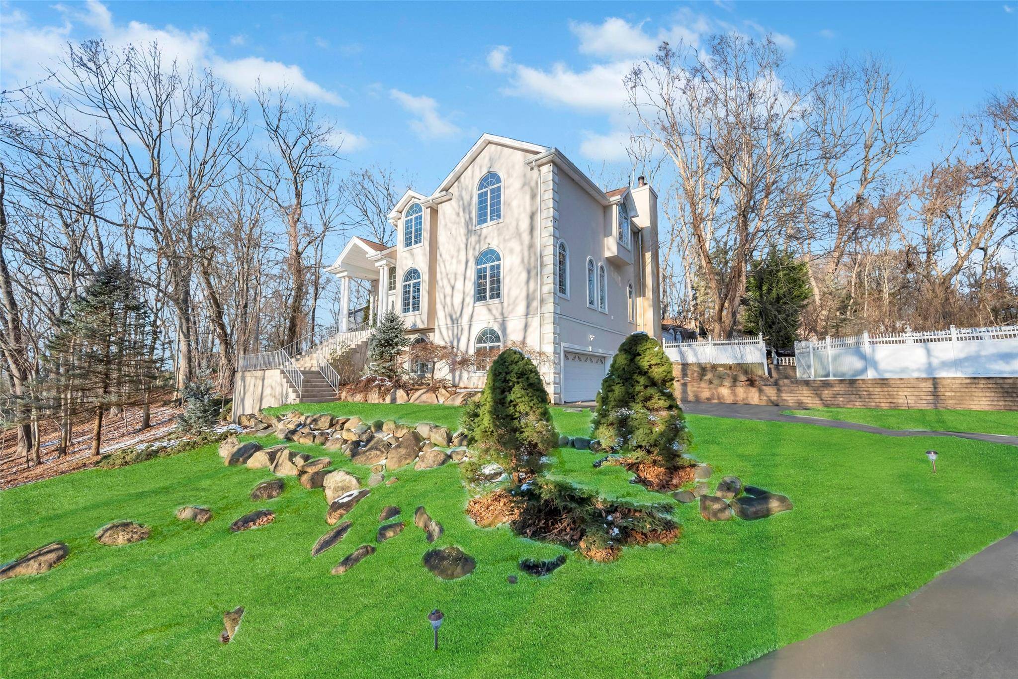 Magnificent Custom Built Post Modern home set in a secluded and pristine setting within Historic Mount Sinai.