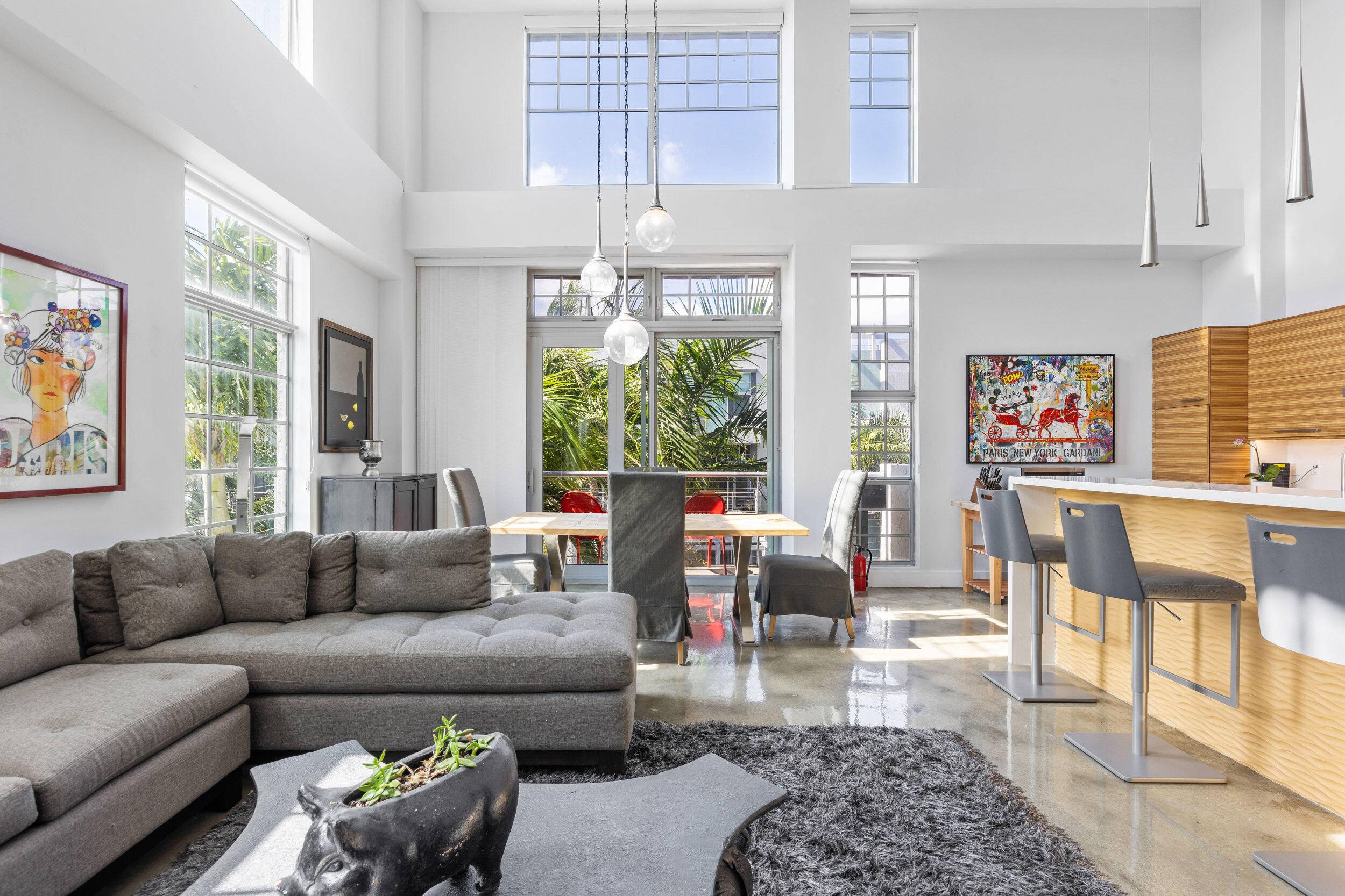 Bright and airy corner penthouse with industrial style design.