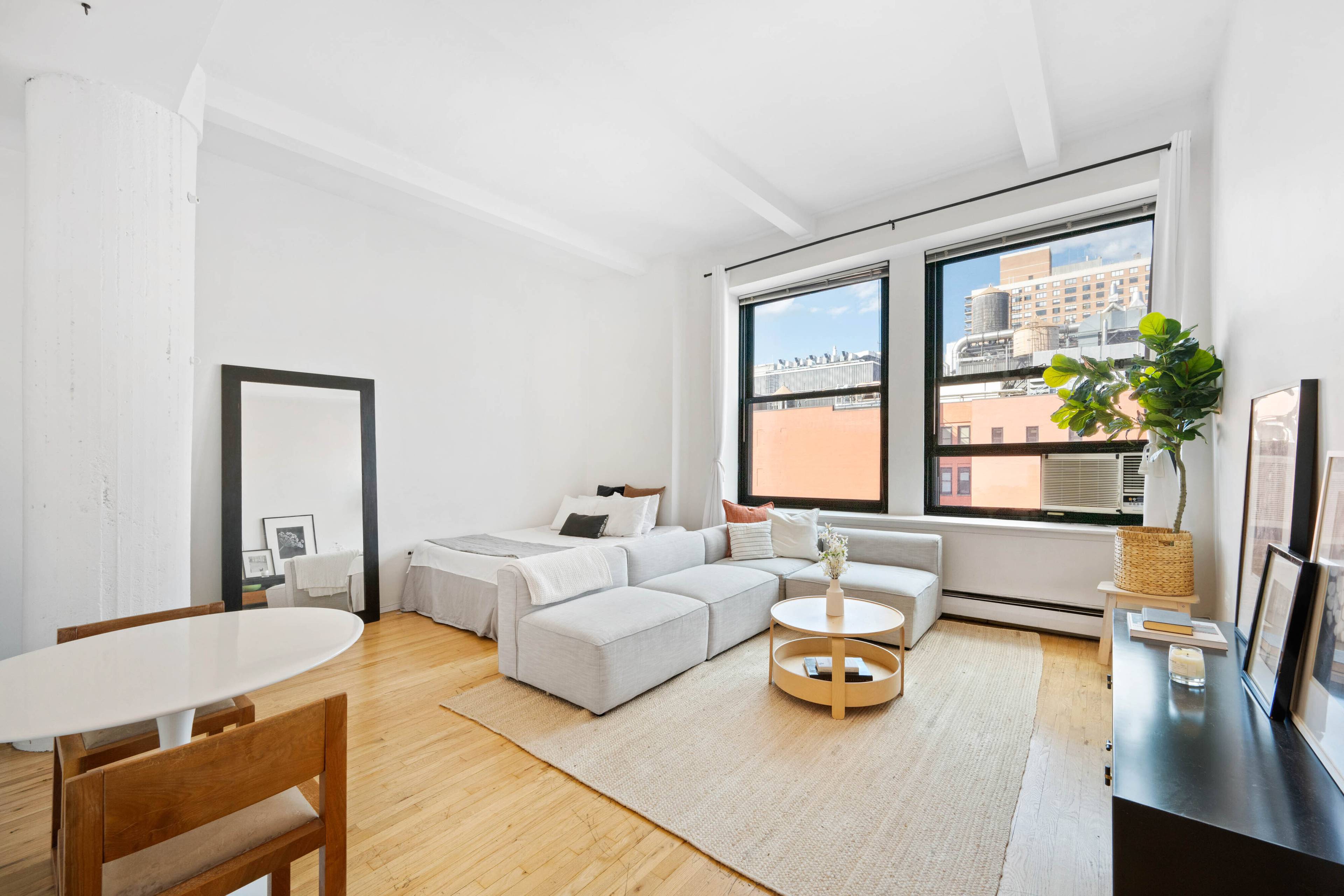 LOFT STUDIO WITH SOARING CEILINGS AND STUNNING SUNLIGHT Enjoy all day sunshine and blue skies in this a bright and airy loft on a high floor in the heart of ...