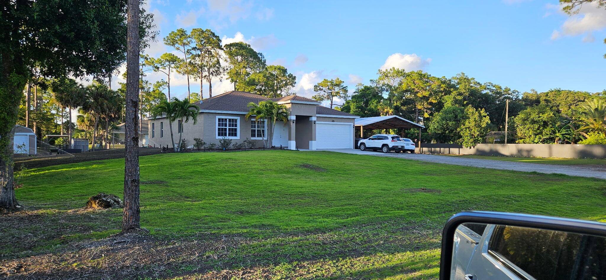 Immaculately maintained 4 2 2 with pole barn and shed on a beautiful 1.