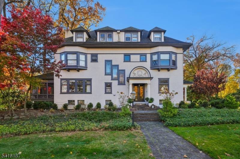 Welcome to this magnificent Colonial Revival estate on nearly three quarters of an acre, just 0.