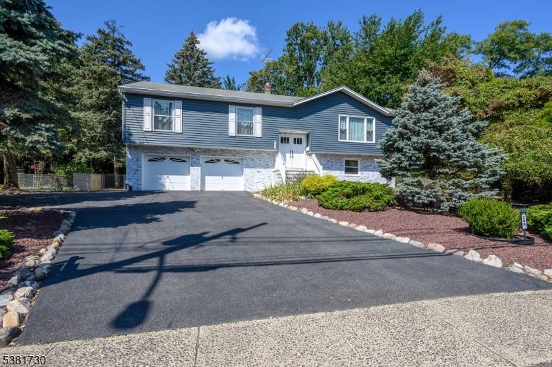 Stunning, meticulously maintained bi level with numerous UPGRADES !
