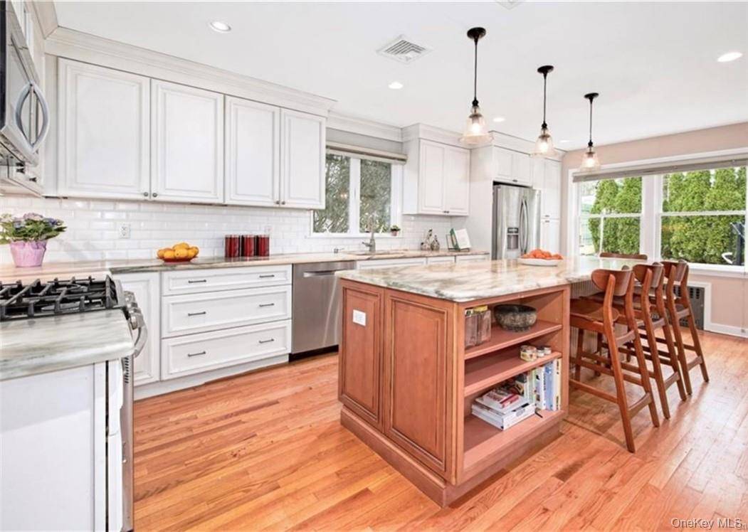 This delightful home is situated on a tranquil, tree lined street in the highly sought after Edgewood area of Scarsdale.
