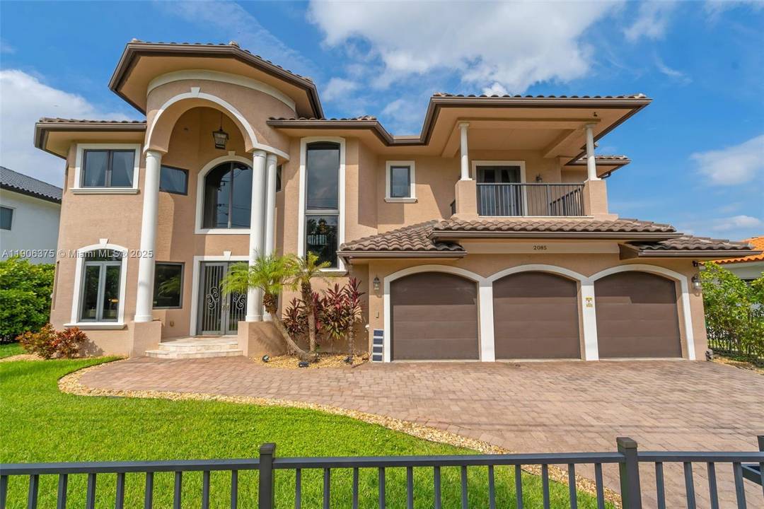 Beautiful two story waterfront home built in 2017, located in the prestigious guard gated Keystone Islands of North Miami.