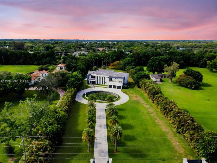 Welcome to 13441 Mustang Trail, where scale, privacy, and luxury converge in the heart of Southwest Ranches.