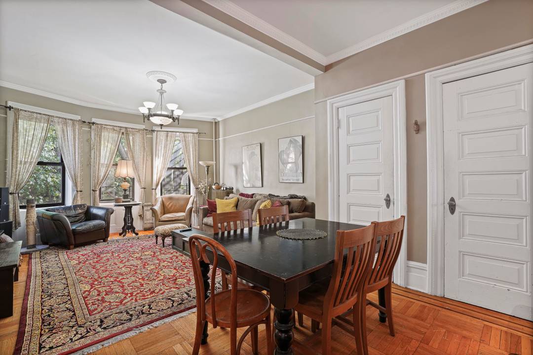 Just one block from Prospect Park, this gracious floor through residence offers classic brownstone character paired with thoughtful modern updates in an intimate, eight unit co op.