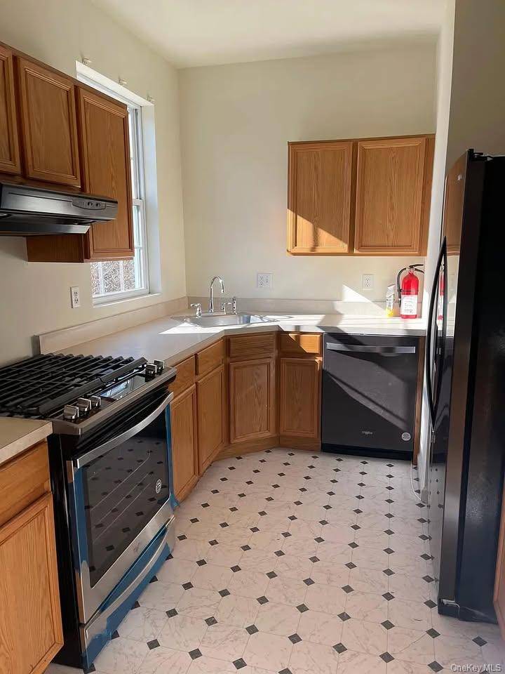 Freshly painted 3 bed 2 bath condo with private terrace, laundry in unit, 2 assigned parking.