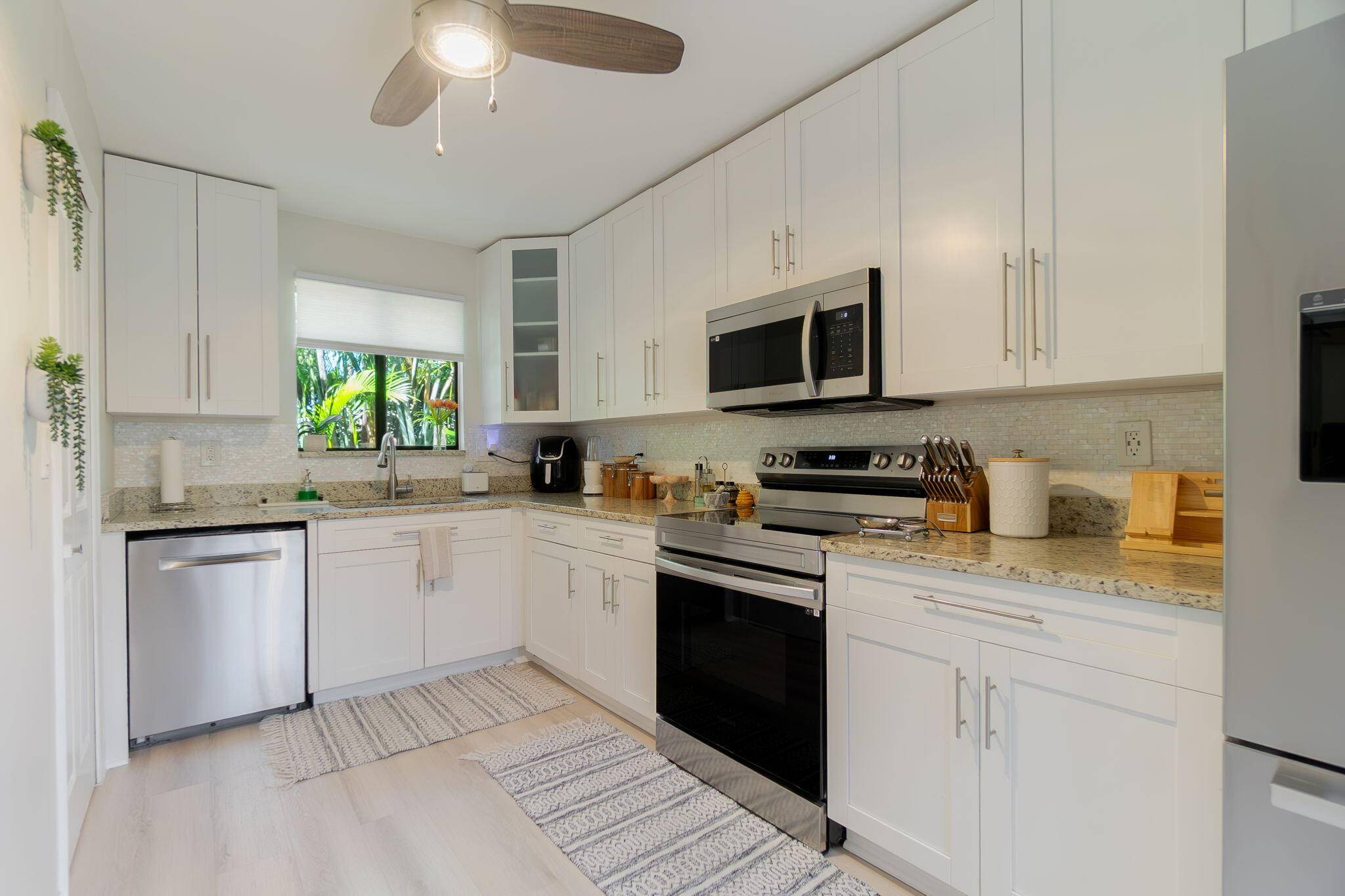 Like new ! This beautifully updated 2BR 2BA villa in the heart of Wellington offers exceptional privacy and a modern, move in ready feel.