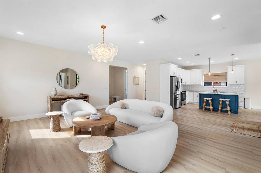 Welcome to a beautifully renovated 3 bedroom, 2 bathroom residence at 7606 S Olive Avenue, where refined design meets effortless South Florida living.