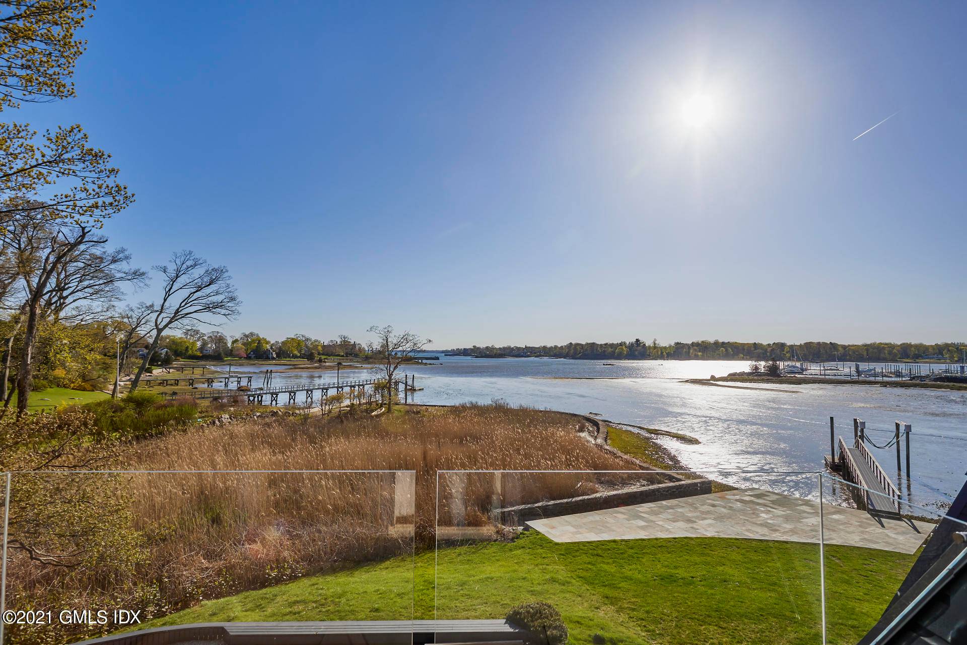 One of a kind, updated contemporary with magnificent water views from almost every room in the house.