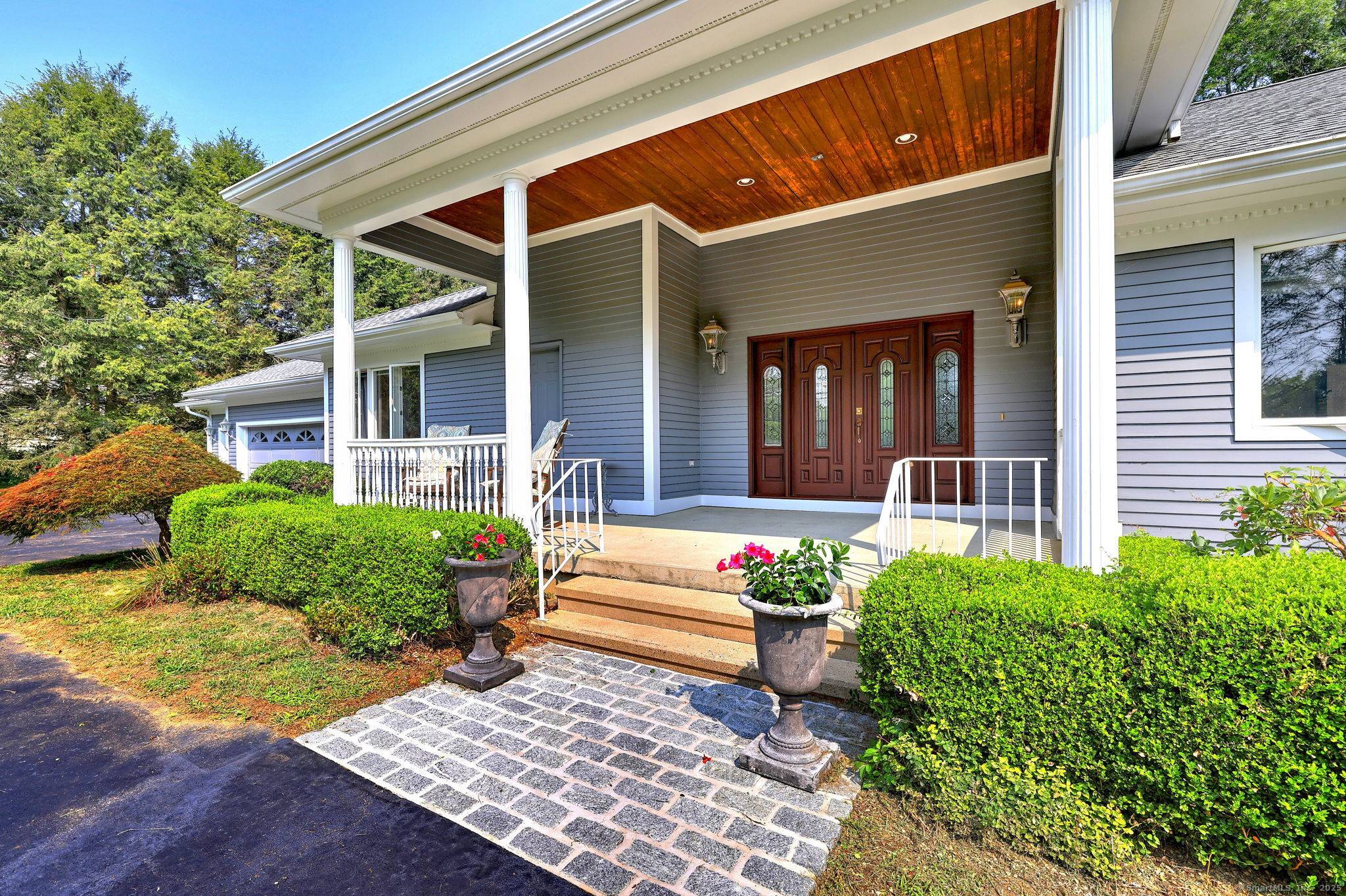 ARCHITECTURALLY UNIQUE RANCH WITH HIGH QUALITY CONSTRUCTION NESTLED ON QUIET CUL DE SAC THAT BORDERS ON THE BEAUTIFUL TRADITIONS PUBLIC GOLF CLUB AT OAK LANE.
