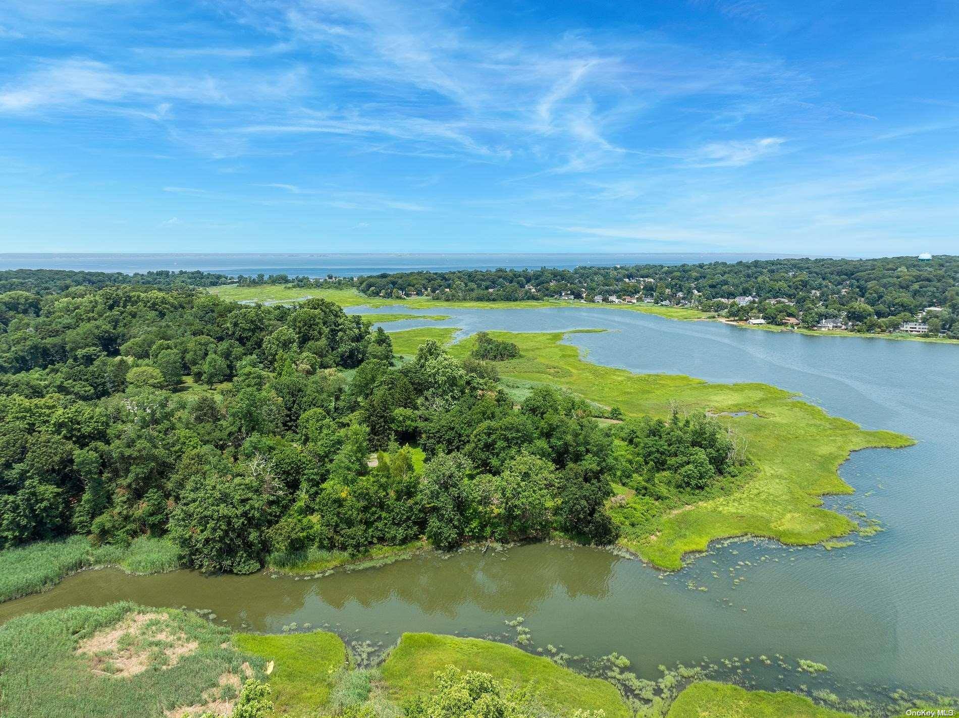Stunning 18 Acre Estate in Lattingtown A Unique Blend of History and Natural Beauty Discover an exceptional opportunity to own the last major parcel of the historic Underhill Farm, nestled ...