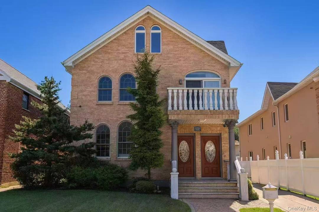 unique All Brick Luxury 2 Families locate in prime bayside !