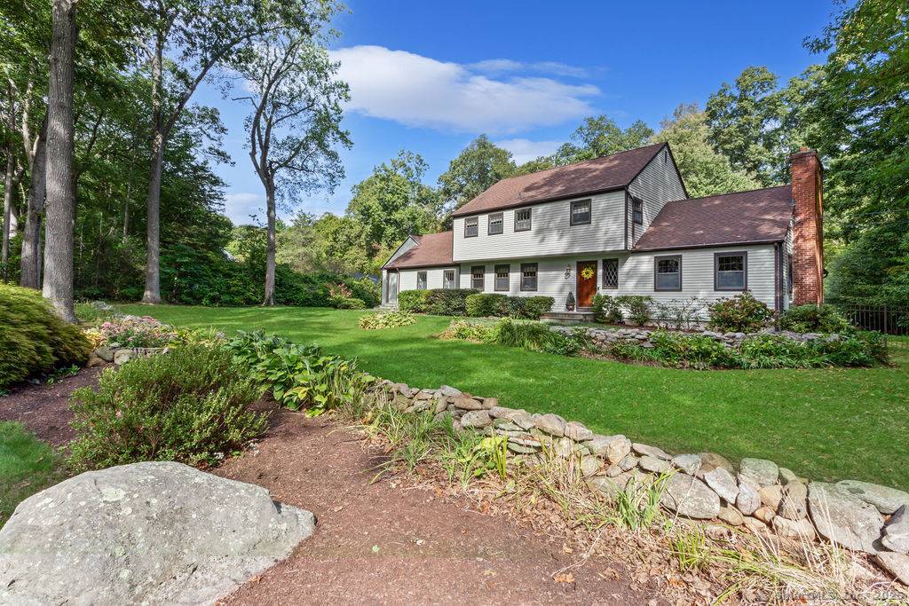 Spacious Colonial close to Town Center boasting unique first floor, handicap accessible, in law apartment with separate entrance, full kitchen, large family room and bedroom suite.