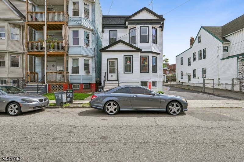 Welcome to this beautifully renovated two family property that offers modern living with exceptional functionality.