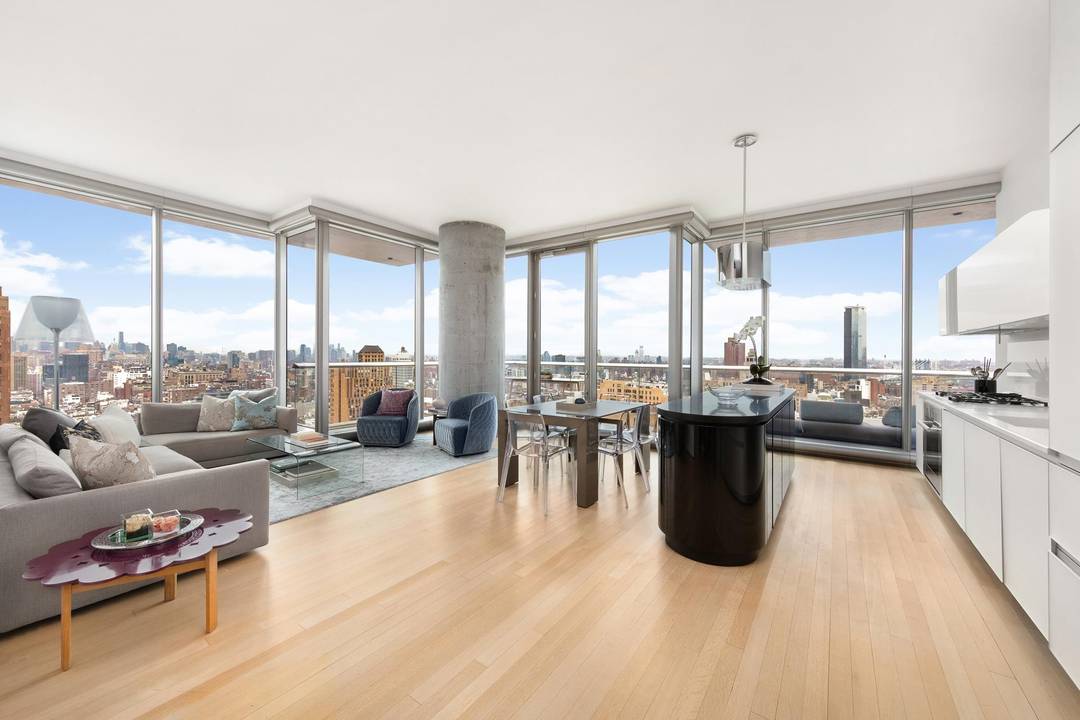 Step into a world of light, space, and luxury in this expansive three bedroom residence, perched high above Tribeca with panoramic skyline and river views.