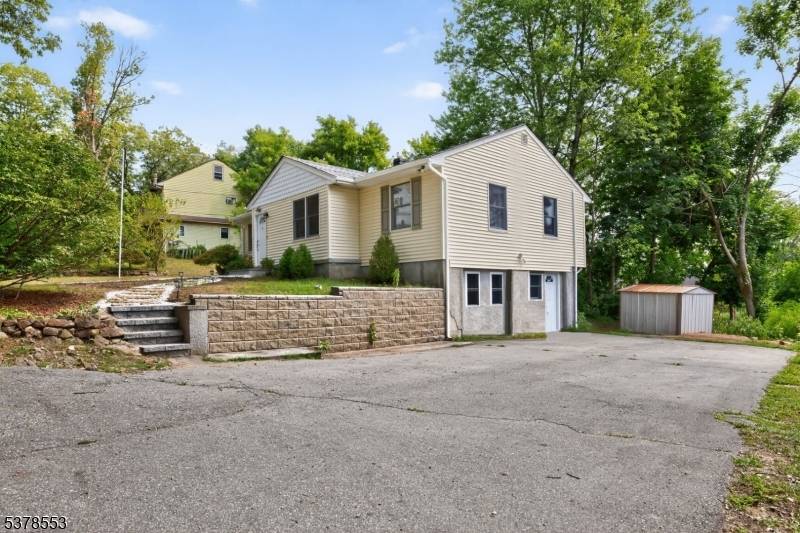 Welcome to 1 Gorge Dr, a beautifully renovated raised ranch located in the highly desirable Rainbow Lake section of Haskell Wanaque.