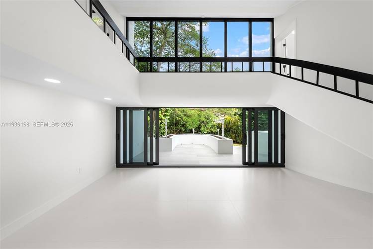 AVAILABLE AUGUST 15TH. Experience refined living in one of Coral Gables' most exclusive gated communities.