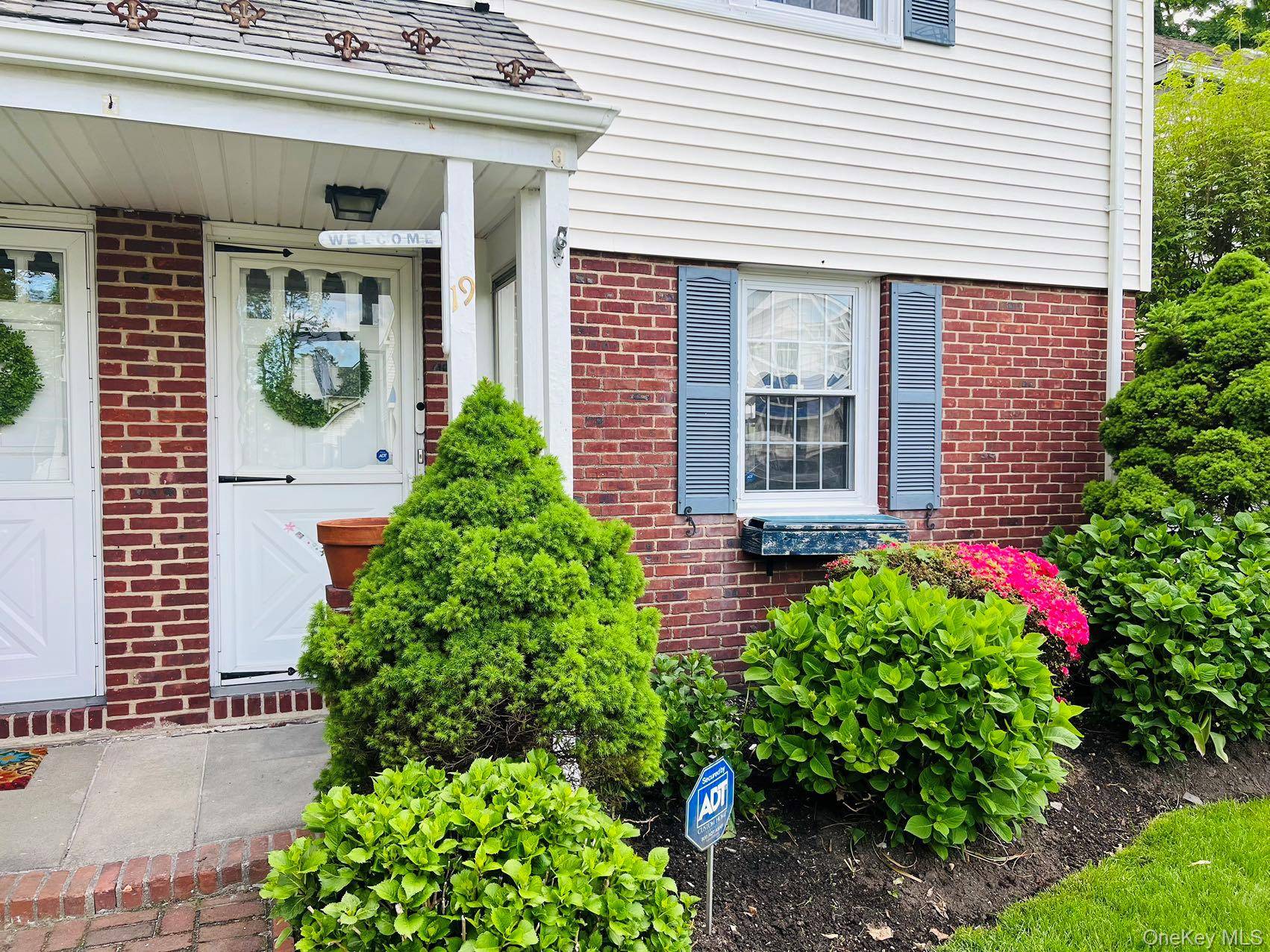 A charming townhouse for rent featuring 2 bedrooms, an office, and renovated full bathrooms, along with a detached 2 car garage and a backyard.