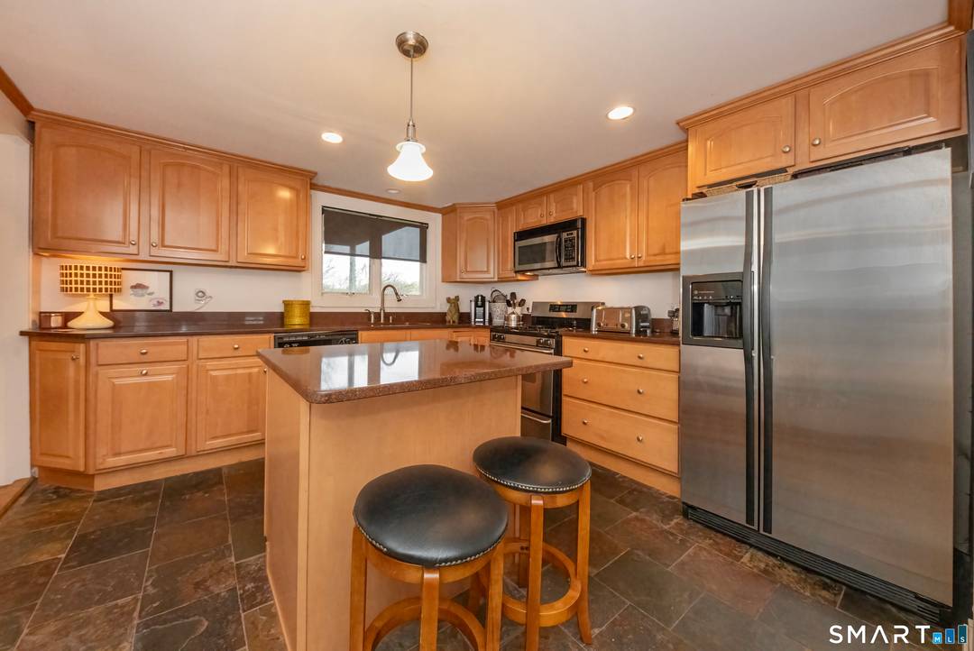 Beautifully maintained 3 bedroom, 2 bath Cape nestled on a quiet cul de sac in a highly desirable shoreline community.