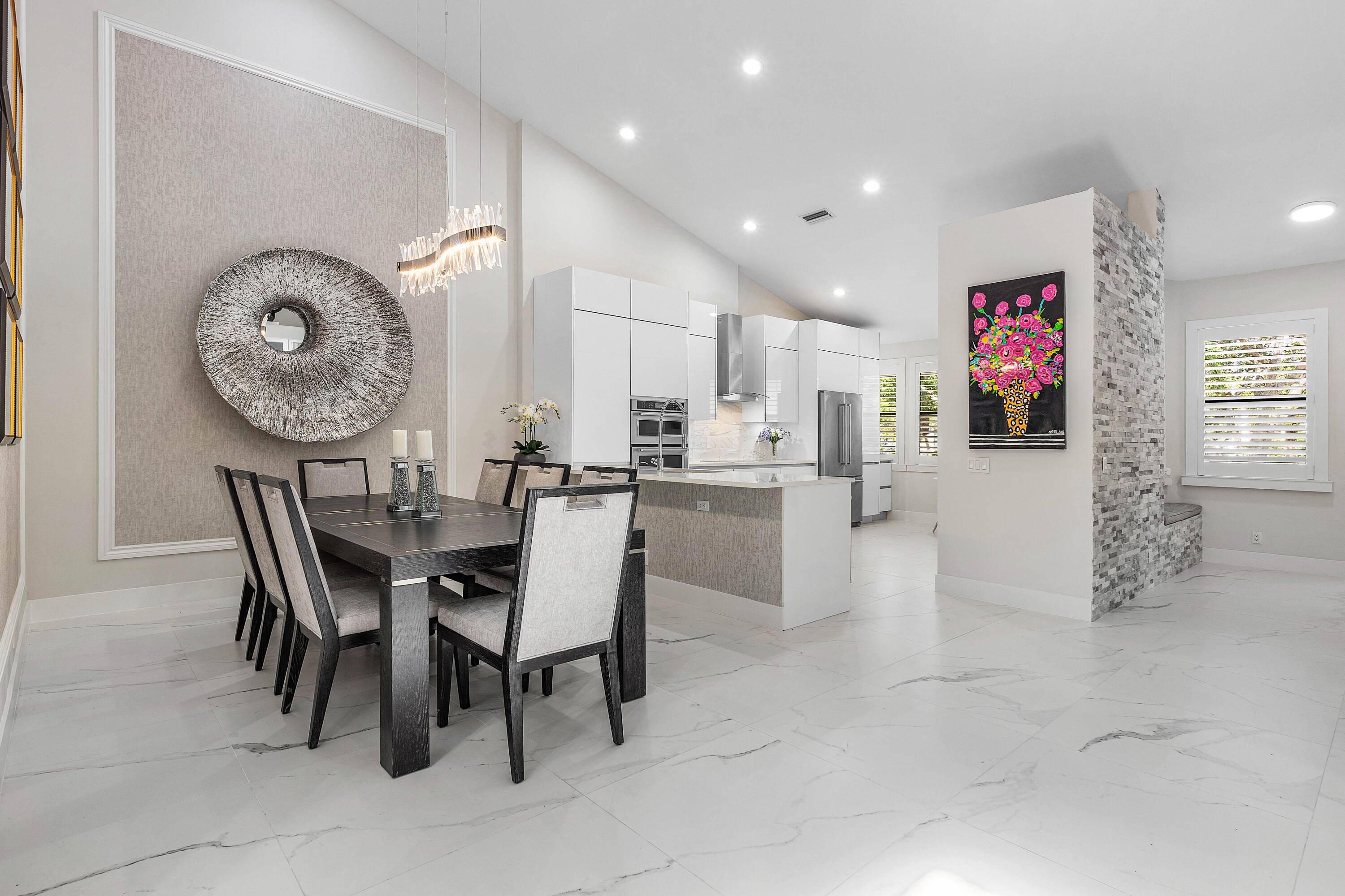 This stylishly renovated penthouse condo blends modern finishes with thoughtfully curated design.