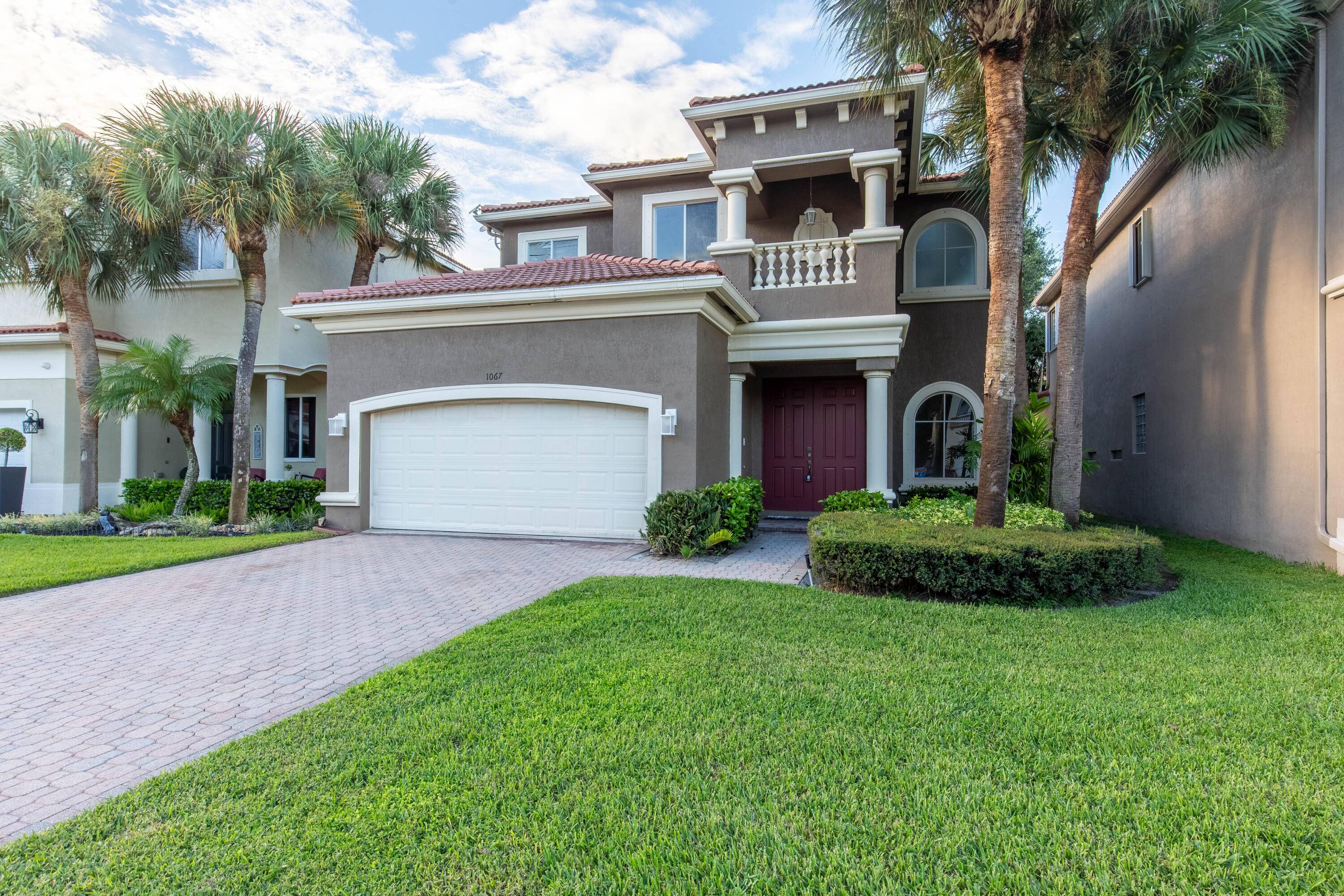 Located in the highly desirable gated community of Palmyra Estates in Boynton Beach, this stunning Mediterranean style 4BR 2.