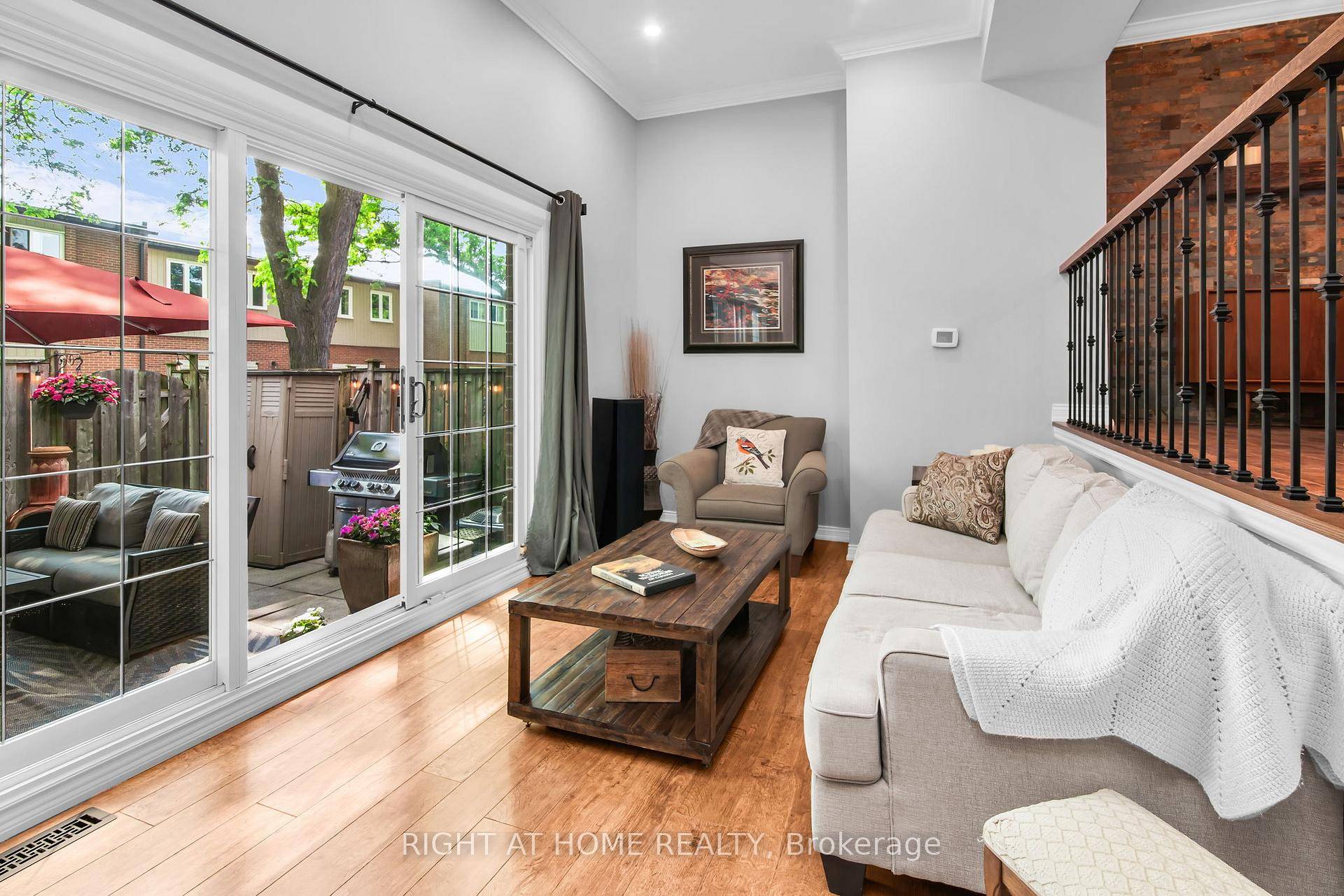 Beautiful 3 bedroom split level townhome features 12' cathedral ceiling in living room with a picturesque window walk out to a serene patio and garden oasis, complimented by a raised ...