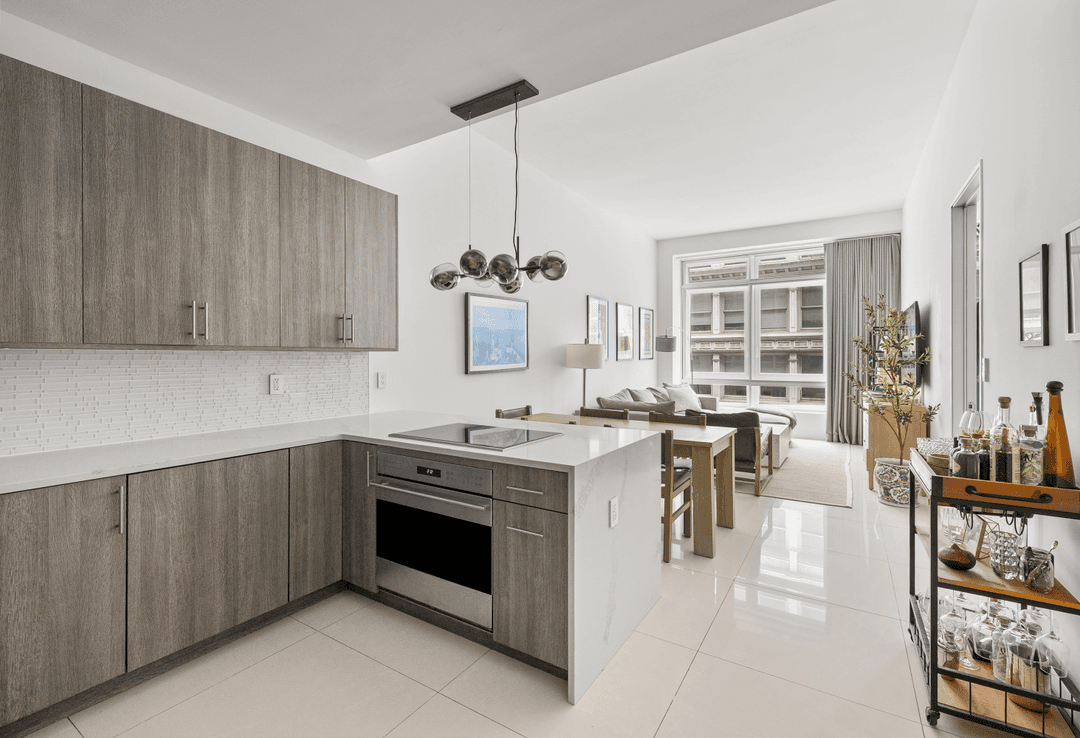 SPACIOUS ONE BEDROOM WITH HOME OFFICE, TWO FULL BATHS amp ; PRIVATE STORAGE IN PRIME FIDI Welcome to The District, a premier full service condominium offering unparalleled amenities in the ...