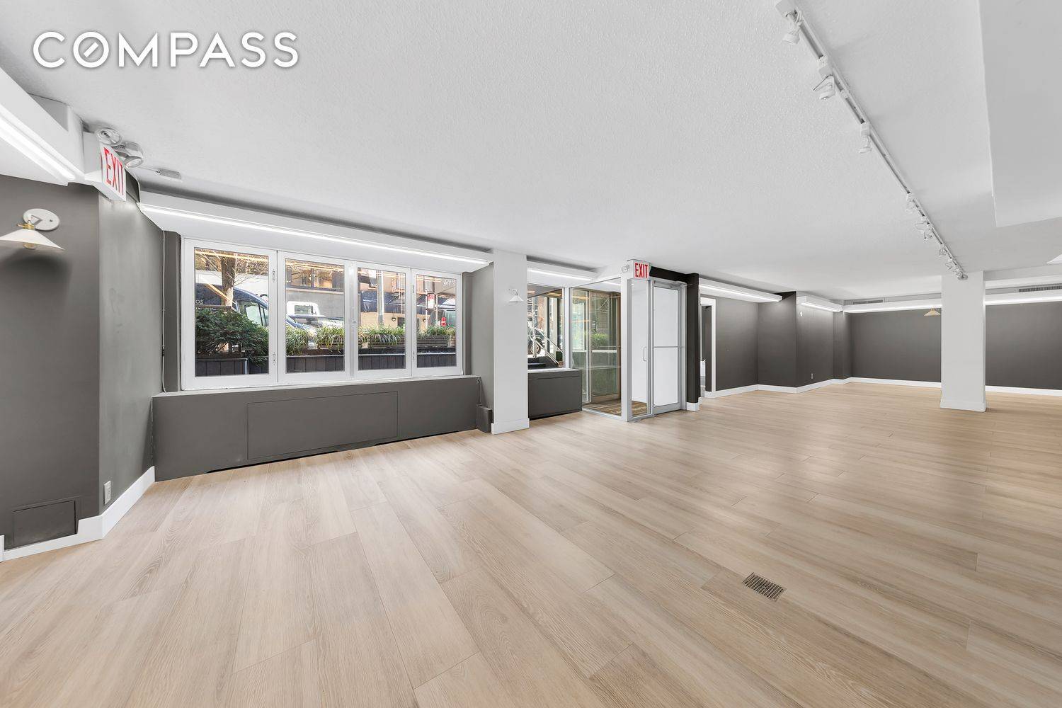 The Property features approximately 50 feet of frontage with a striking wall of windows, offering excellent street visibility.