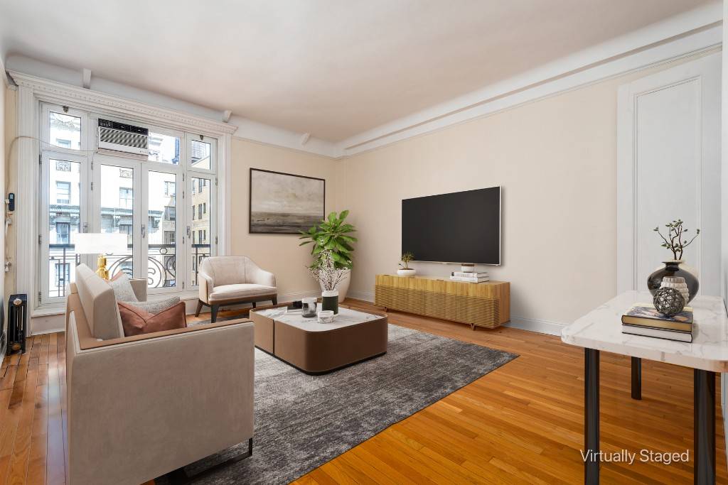 Bathed in natural light from three exposures, including the all day northern sunlight, this expansive apartment immediately feels welcoming and serene.