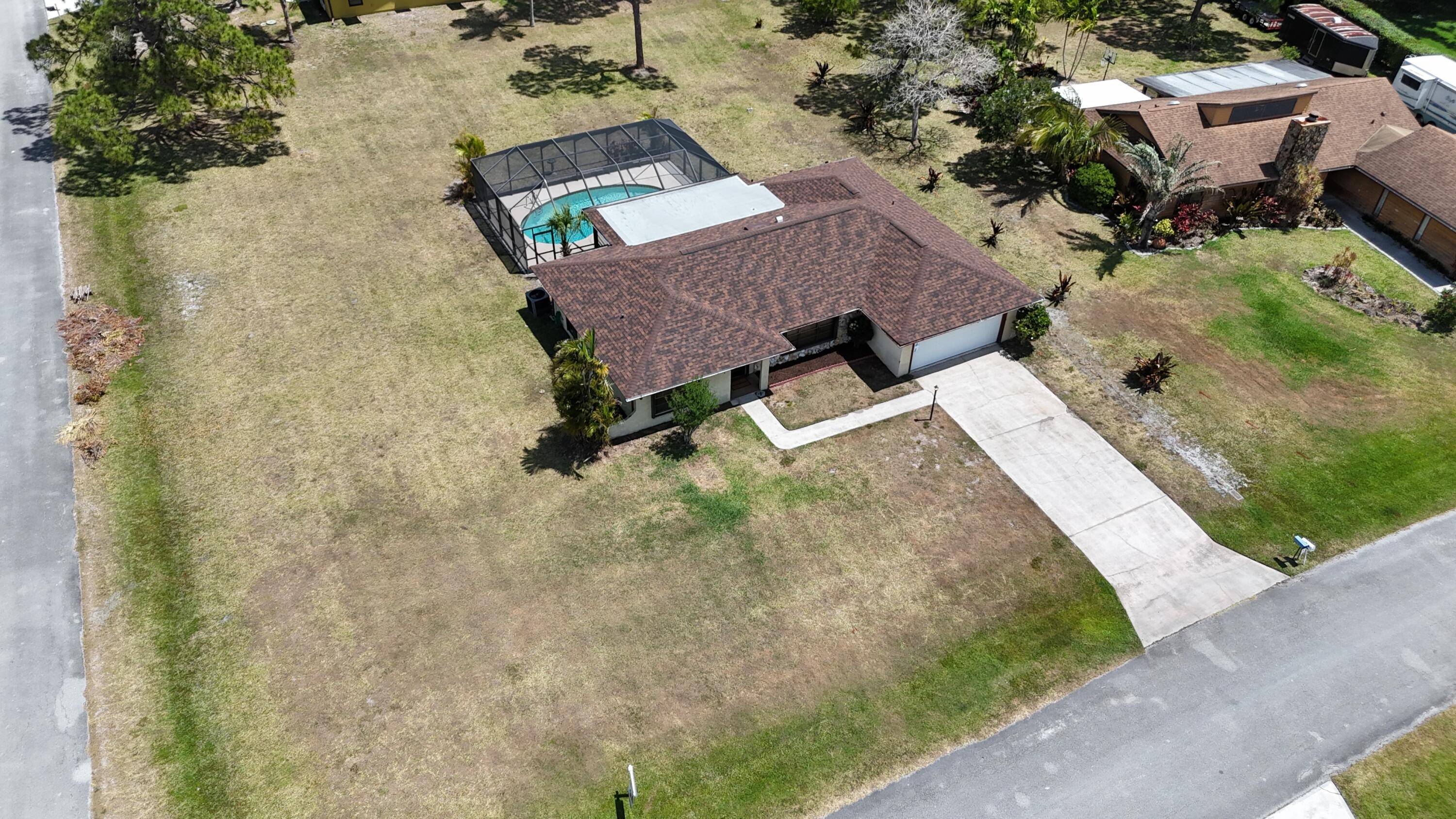 Opportunity Knocks ! Check out this rare find 3 bed, 2 bath, 2 car garage home on large HALF ACRE corner lot with POOL.